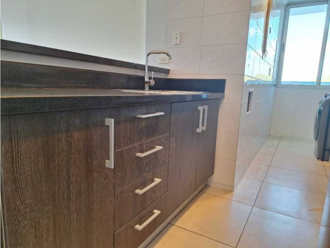 Contemporary kitchen with dark wood cabinetry and granite counters at PH Miraflores