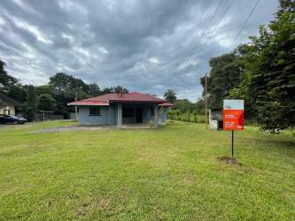 Spacious unfurnished living room with tile floors and bright windows in Los Algarrobos house