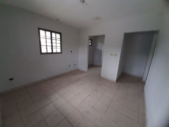 Bright empty bedroom tile floors natural light Los Algarrobos house Chiriqui