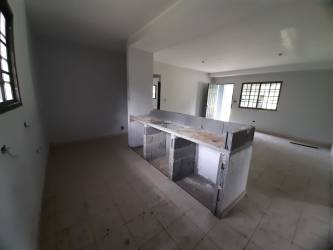 Large front yard with grass and driveway of house Chiriqui Panama