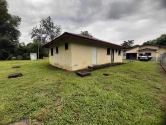Open kitchen space with tiled floors, windows, unfinished in Los Algarrobos house