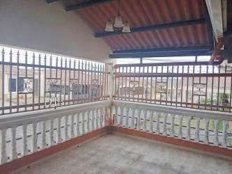 Charming covered balcony with tile flooring and wrought iron railing Montelimar La Chorrera