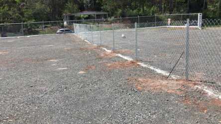 Vacant commercial land parcel on main road with flat terrain and fencing ideal for development in Arraiján Panama