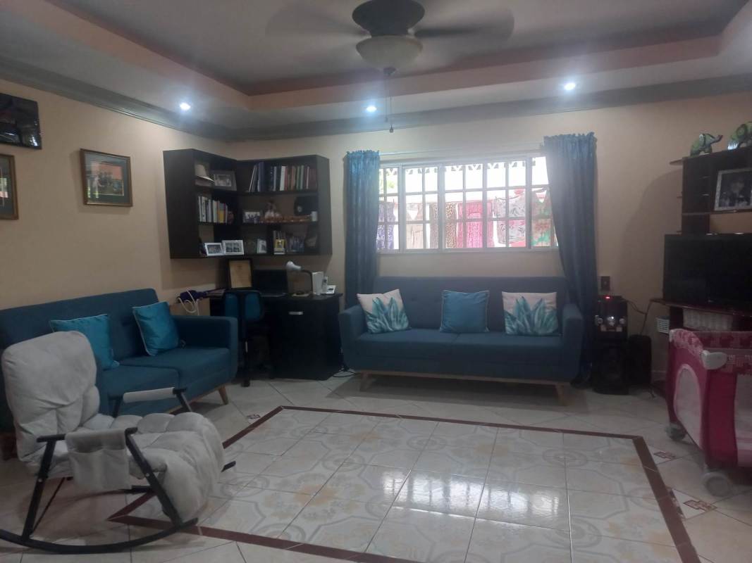 Kitchen with granite countertops, wood cabinets, natural light Panama house for sale