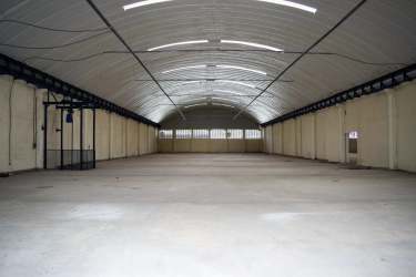 Empty wide warehouse interior with high ceilings and reinforced concrete floor Colon Free Trade Zone Panama