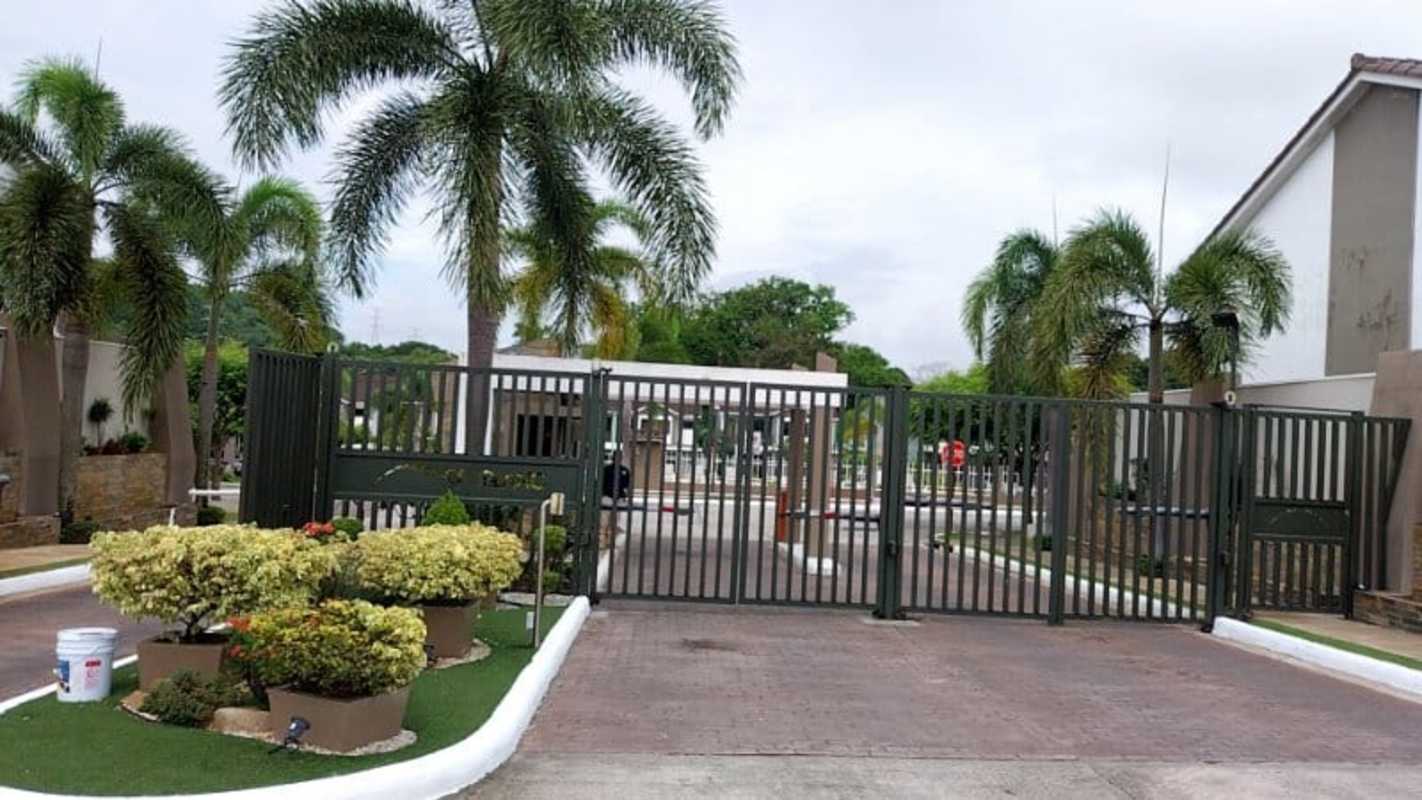 Secure gated entrance with landscape at Mont Blanc residential gated community Panama City