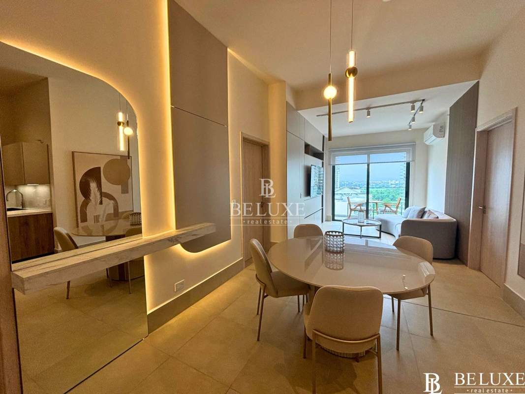 Elegant modern living room with balcony access and ocean view in furnished apartment at PH Ocean House Santa María Panama