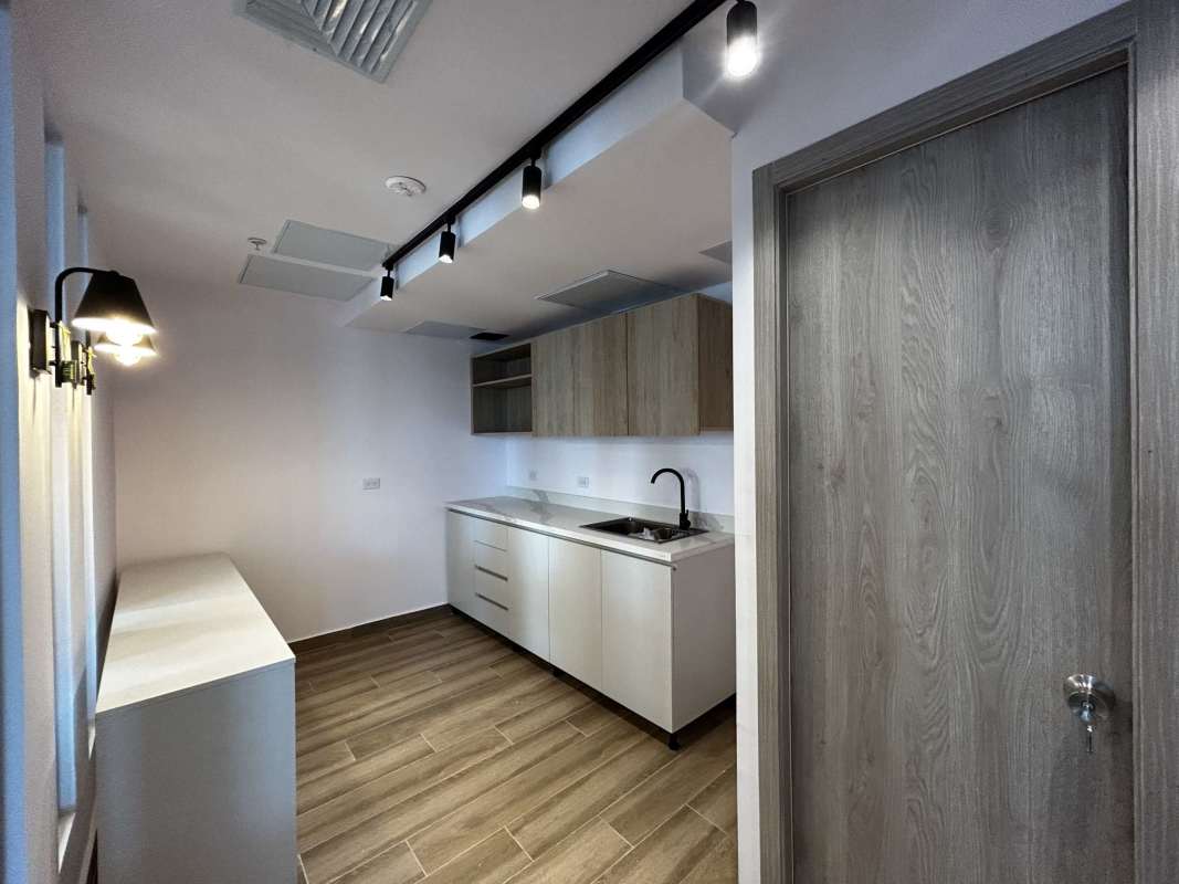 Modern enclosed office with glass walls and ambient lighting in Financial Park Panama