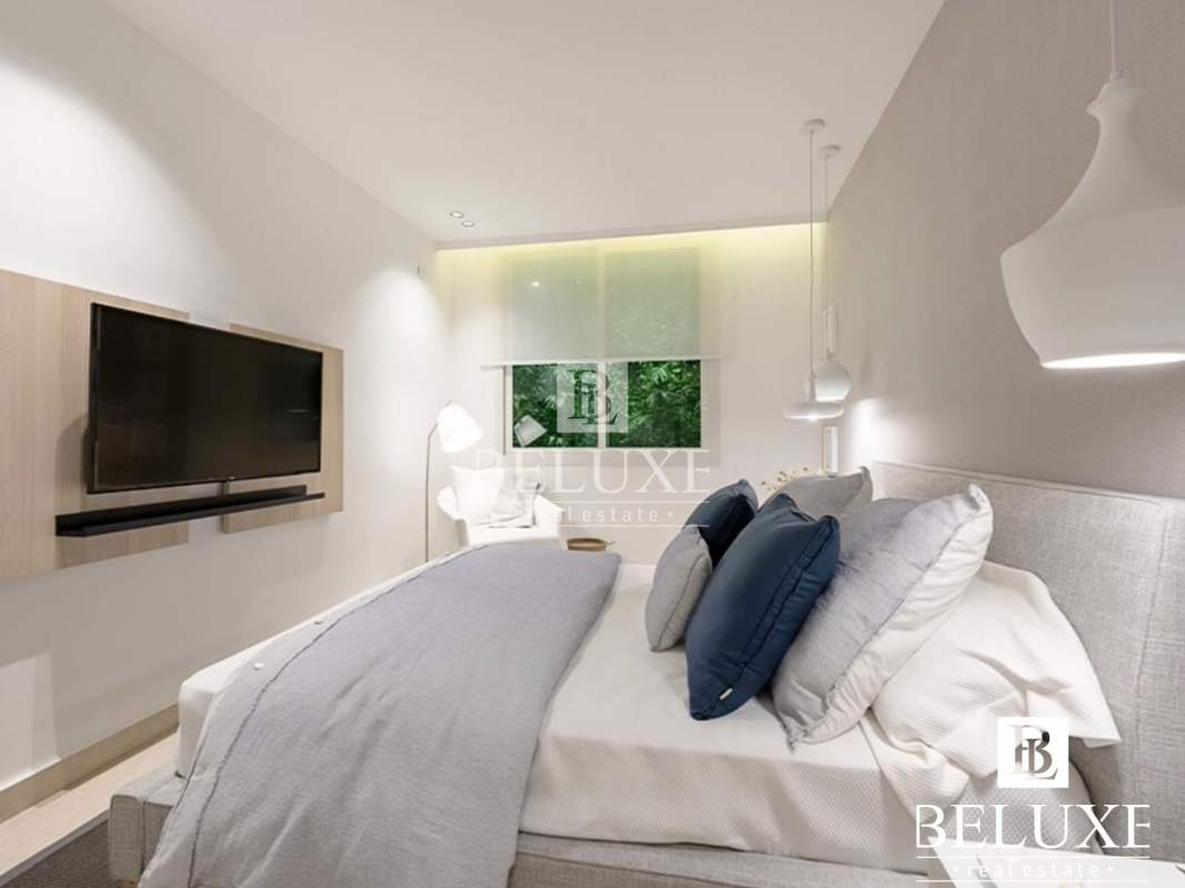 Modern minimalist bathroom with walk-in glass shower and designer sink in PH Van Gogh El Cangrejo