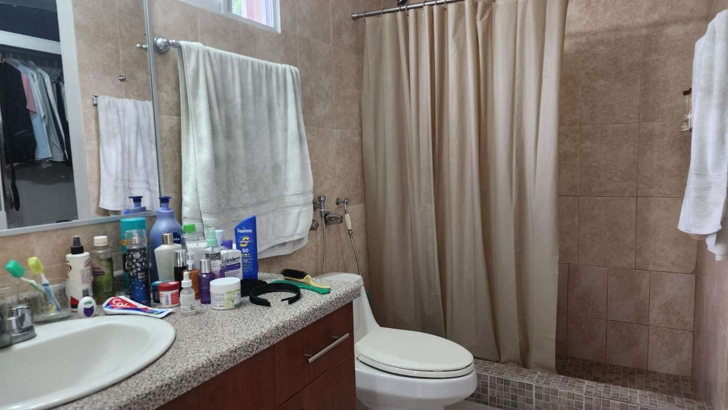 Modern bathroom with granite sink and walk-in shower Altos de Panamá