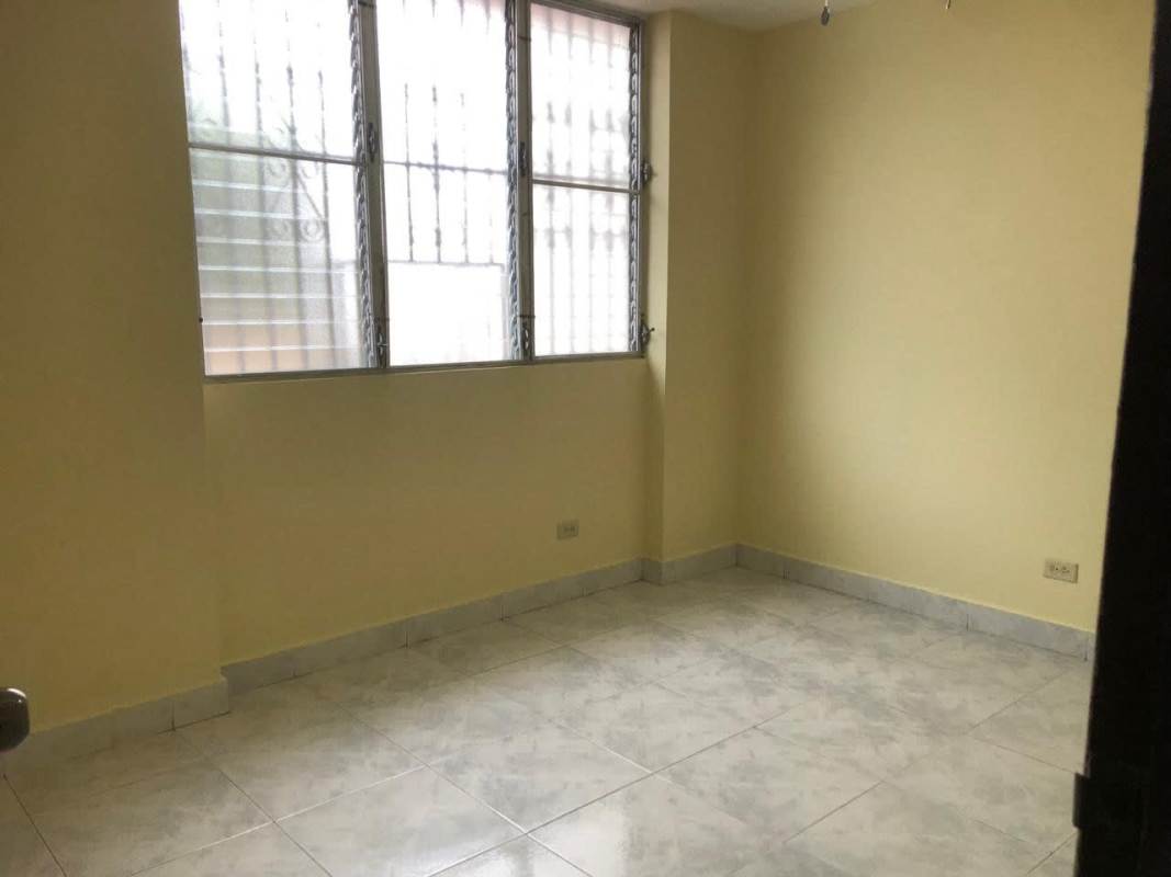 Bedroom with large window and tiled floors in PH Gamma Real Betania Panama City