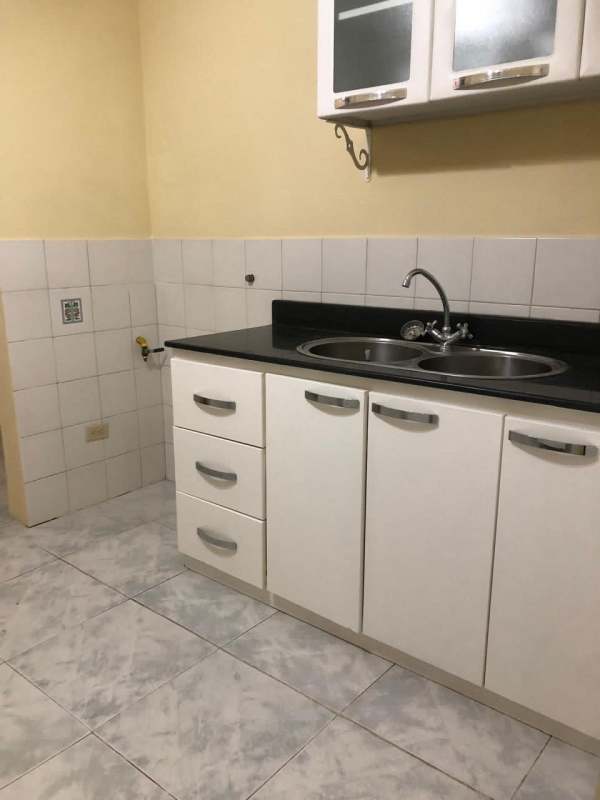 Simple bathroom with pedestal sink, mirror and toilet in PH Gamma Real Betania