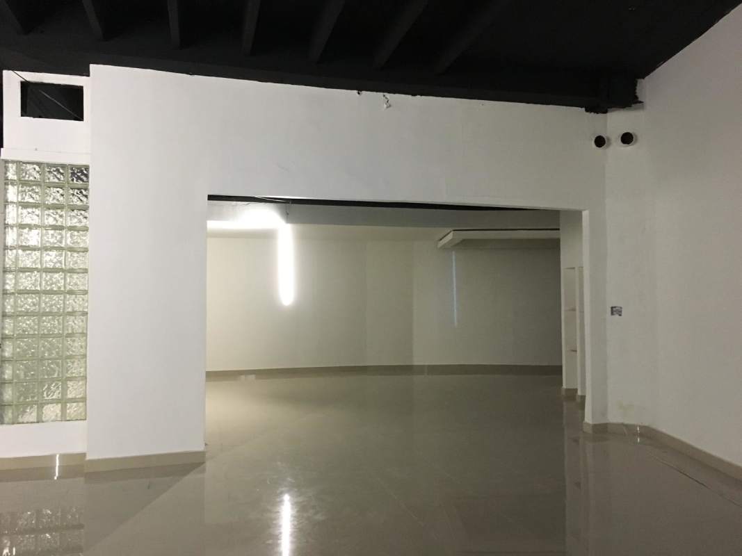 Open industrial look commercial interior with polished floor and exposed ceiling beams Hotel Panama Panama City.