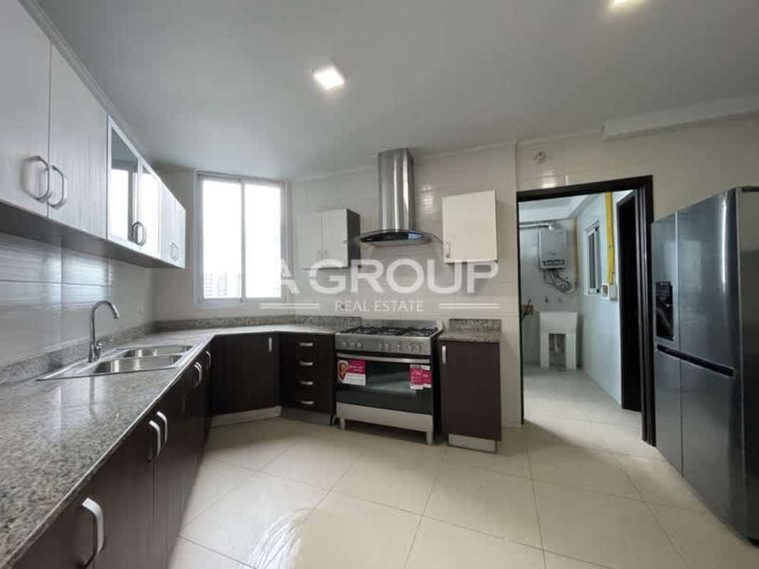 Furnished apartment kitchen granite countertop and stainless appliances PH Country Club Costa del Este Panama