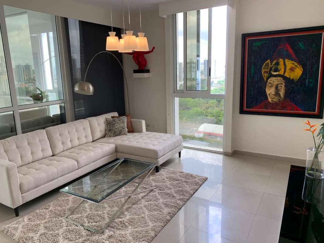 Open-plan living and dining area with balcony access in San Francisco Panama PH Quadrat