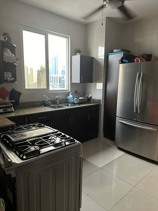 Modern granite kitchen with stainless steel appliances gas stove PH Miyaki Penthouse Obarrio Panama