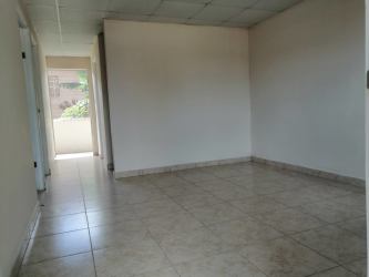 Living room area with hallway leading to bedrooms ceramic tile affordable rent Panama