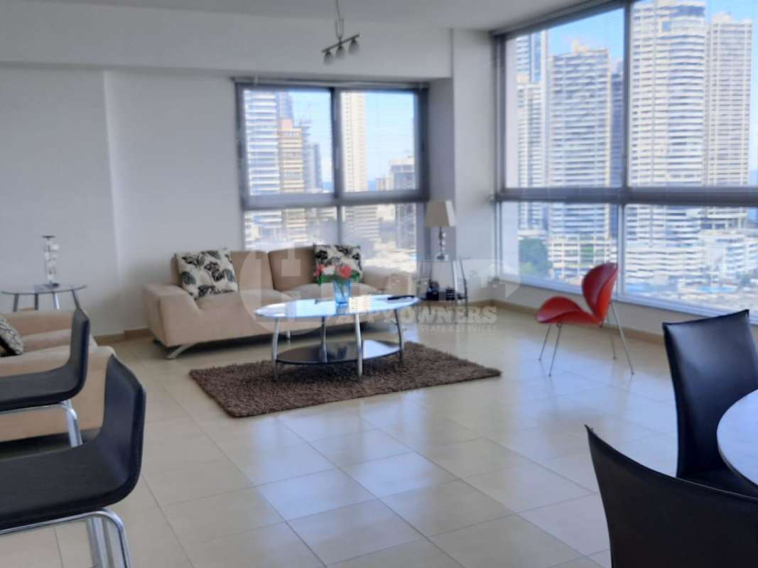 Kitchen with granite countertops, white cabinets, stainless steel appliances PH Grandbay Tower Avenida Balboa Panama
