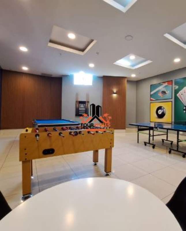 Recreational game room with foosball, ping pong and wood accents at PH Allure at the Park