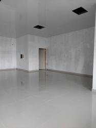 Empty unfinished office with tile flooring and high ceiling in Costa Verde La Chorrera