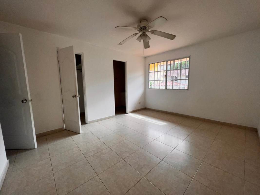 Traditional bathroom with tiled walls, shower and pedestal sink at Condado del Rey house for sale