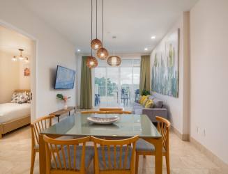 Modern bathroom with glass walk-in shower and vanity in luxury beach apartment