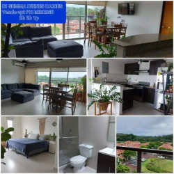 Bright bedroom with large window overlooking nature in Midrise Woodlands Panama Pacifico