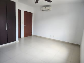 Contemporary kitchen with granite countertop, wood cabinets, stainless steel appliances at River Valley house Panama Pacifico