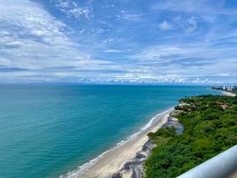 Bright guest bedroom with twin beds, large windows, modern decor at Santa Clara Residences Panama
