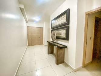 Modern dining area with beach views and elegant finishes at Santa Clara Residences