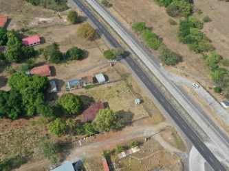 View of large roadside plot suitable for commercial or residential project in Bejuco Panamá Oeste