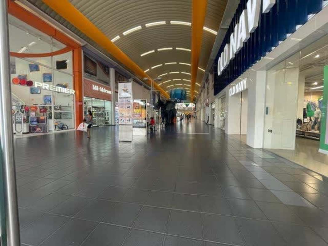 Interior of Albrook Mall featuring carousel and multiple retail kiosks in central concourse Panama City