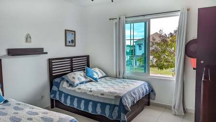 Bright guest room with coastal theme double beds PH Howard Bijao Panama