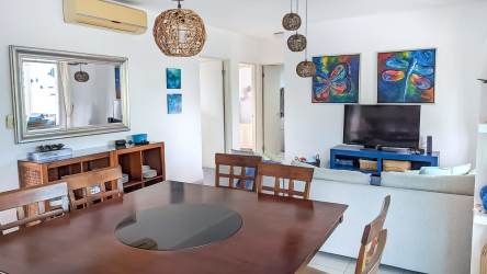 Bedroom inside condo at PH Howard Bijao with twin beds and blue decor Panama beach resort