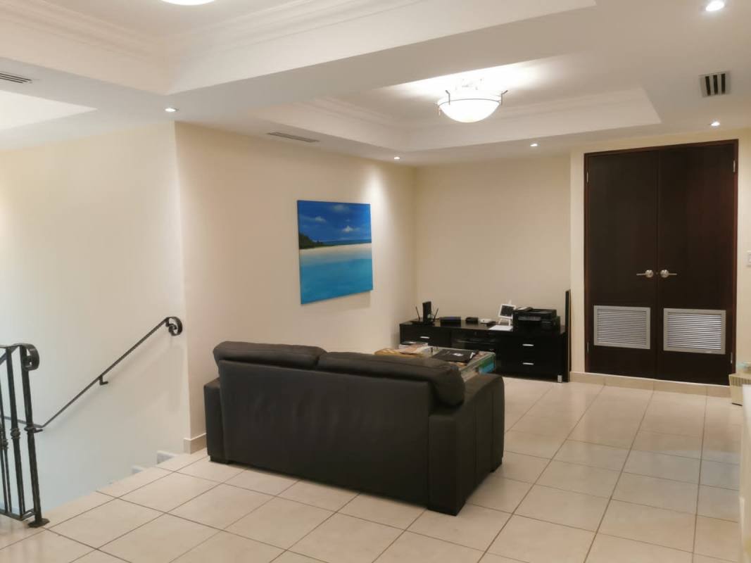 Elegant dining area with large windows and marble flooring in PH Bahía Obarrio apartment Panama City