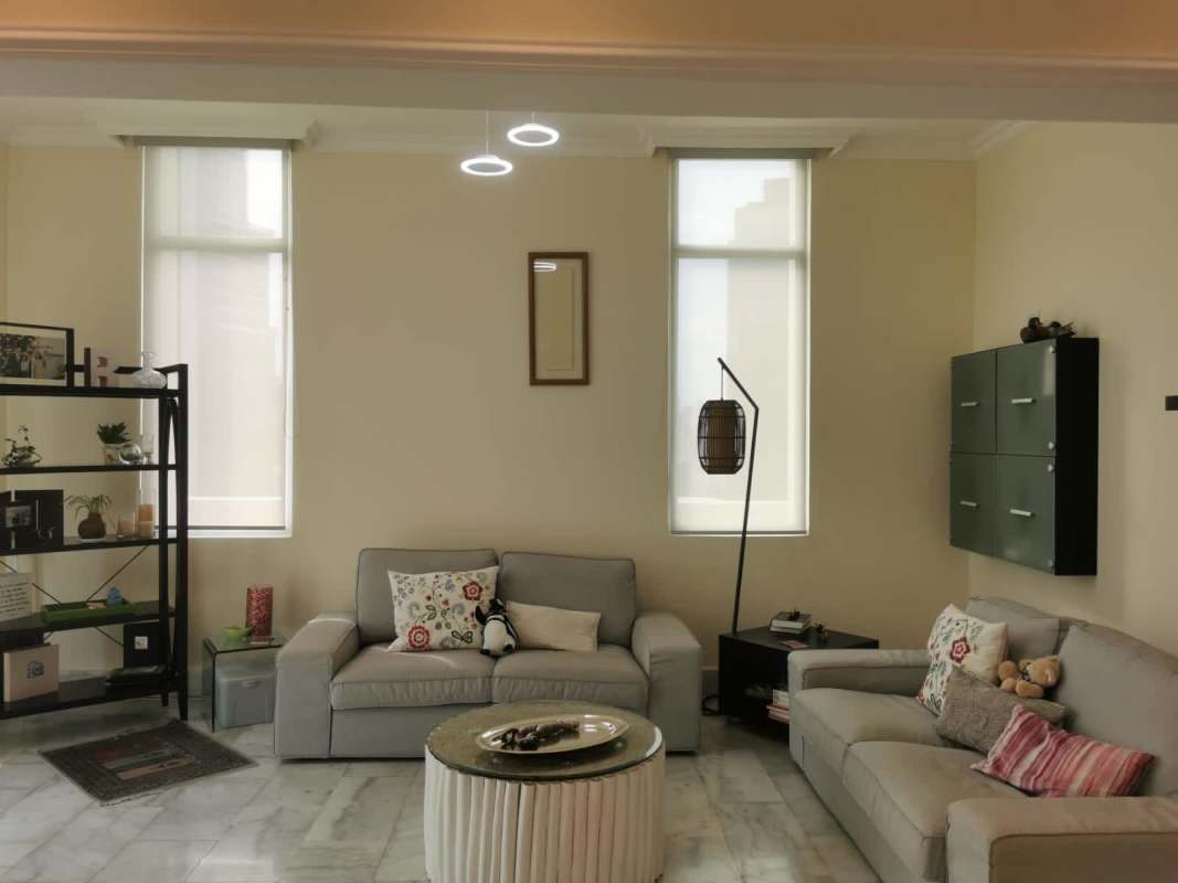 Upstairs family lounge with marble floors in duplex apartment at PH Bahía Obarrio Panama City