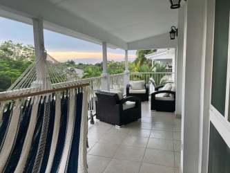 Covered balcony with hammock, seating, ocean breezes at PH Bijao Residences Rio Hato Panama