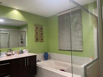 Contemporary bathroom with bathtub, glass shower screen, granite vanity at PH Bijao Panama