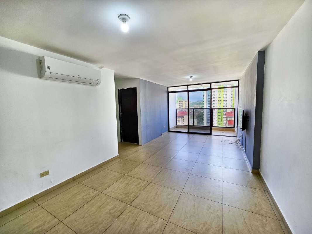 Bright living dining space with TV wall mount tile floors in Condado del Rey