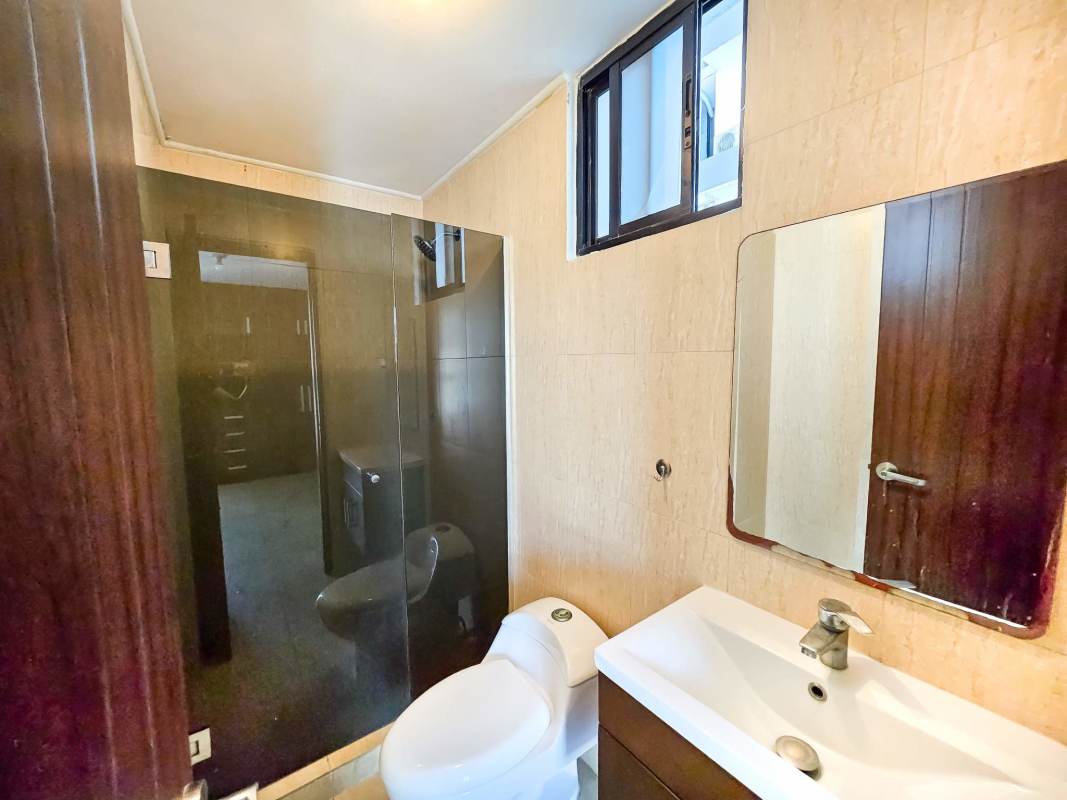 Modern bathroom with glass enclosed shower vanity PH Terrazas del Rey