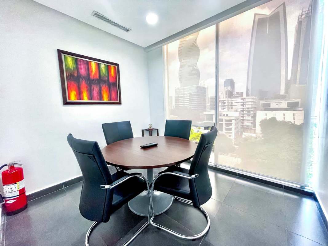 Bright private office with glass partitions and city view at PH Office One Panama City