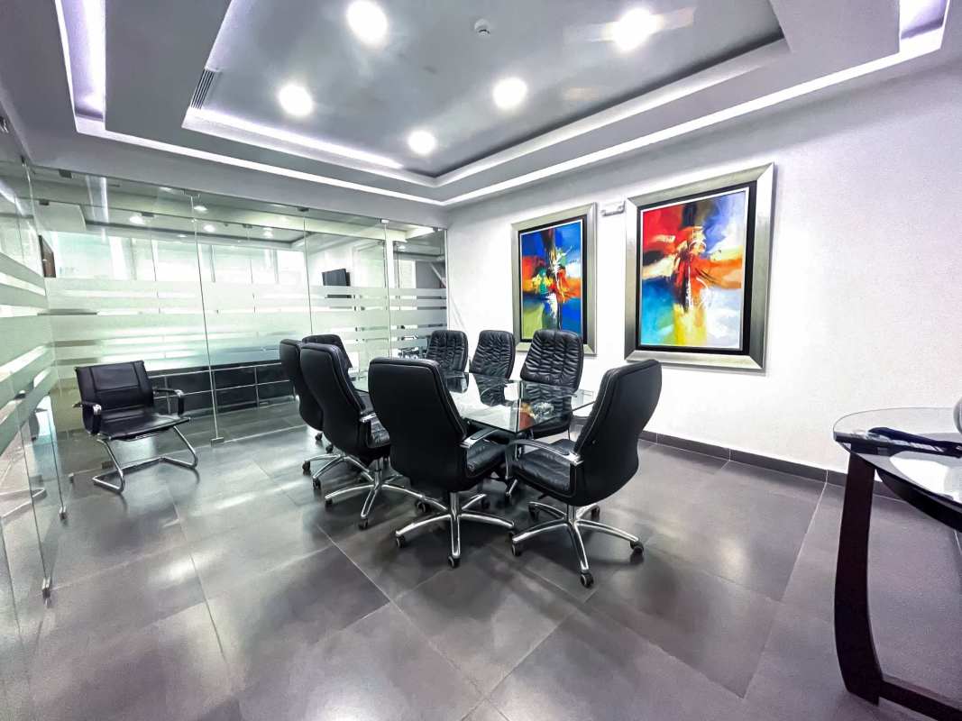 Conference room with glass walls and abstract art PH Office One Tower Panama City