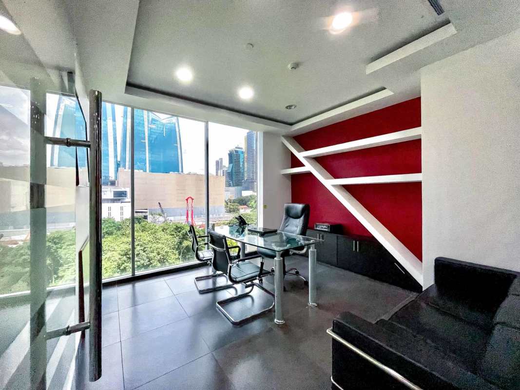 Glass-walled private office with view of Panama skyline in Office One Obarrio