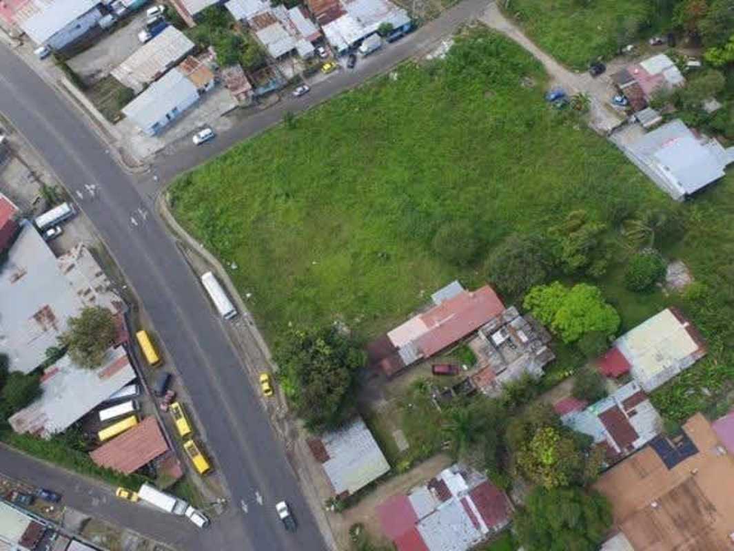 Vacant land surrounded by residential area viewed from above in Pedregal Panama City