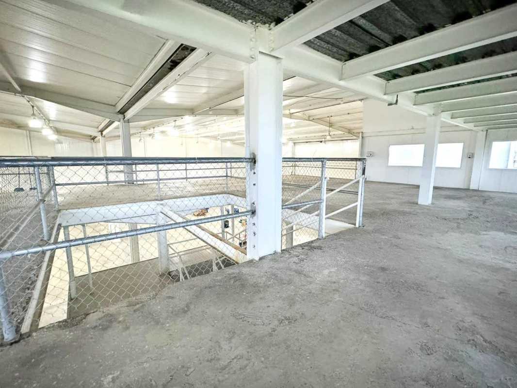 Industrial warehouse mezzanine space with concrete floor safety rails in Pacora Panama