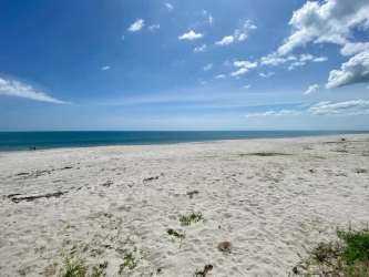 White sand beach with Pacific blue ocean near Buenaventura Panama for sale