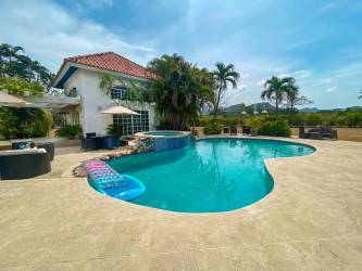 Colorful rustic kitchen with breakfast bar, large windows on estate for sale Chame Panama