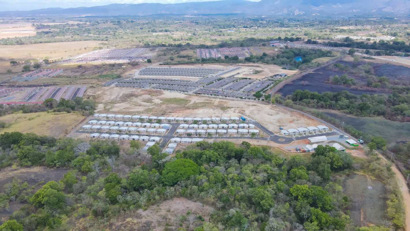 Expansive investment land plot with road and green surroundings in Pacora Panama City