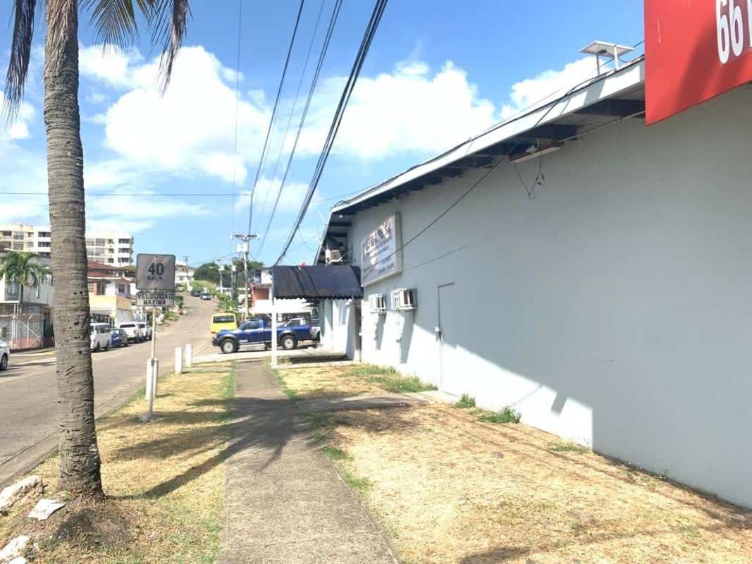 Multiple storefronts with signage parking and busy location in Panama City plaza Fernand Betania