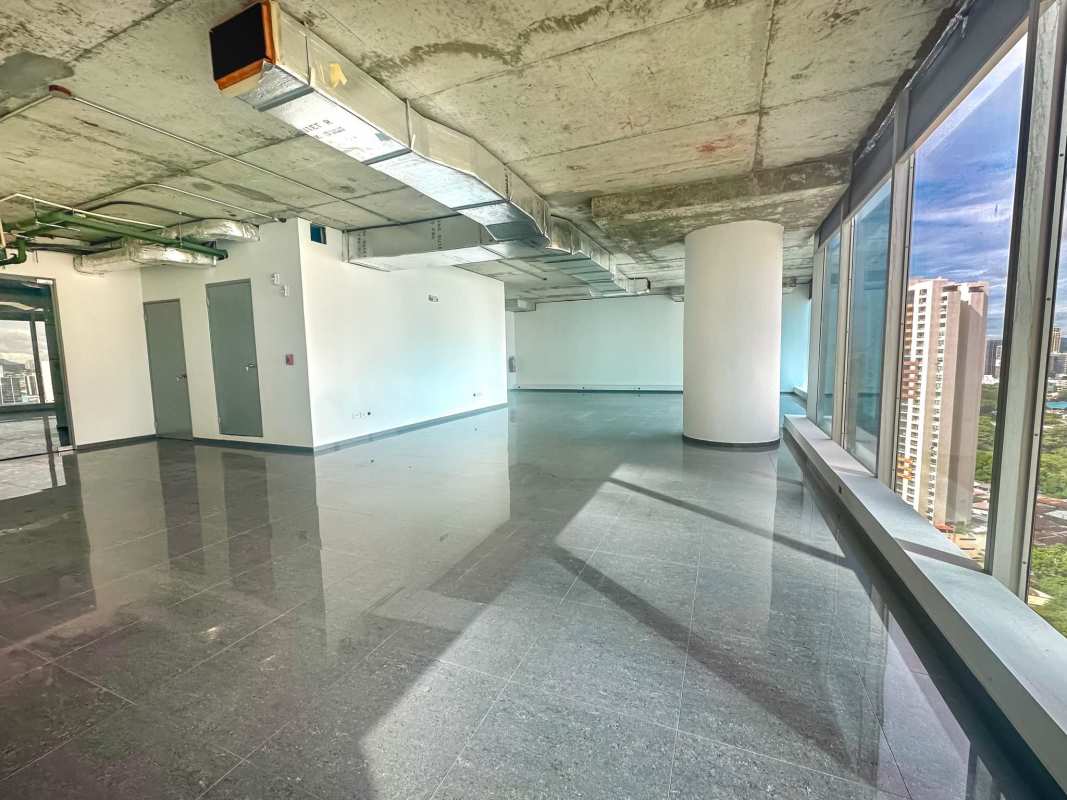 Empty modern commercial office with panoramic windows exposed ceiling at Oceania Business Plaza Punta Pacifica Panama